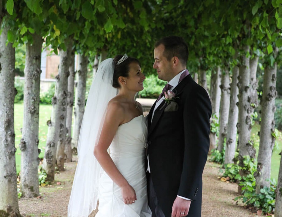 Husband and Wife smiling at each other in the Knebworth House gardens