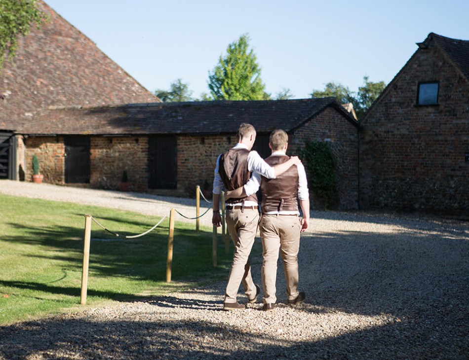 Husband and Husband walking down by The Priory Barns